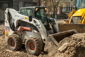 Bobcat machine with bent glass windshield