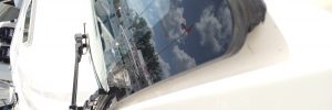 Inspecting caulk on your boat glass windshield