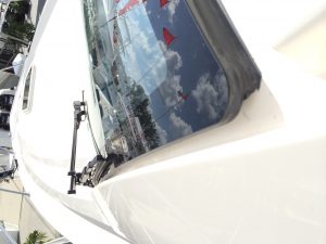 Inspecting caulk on your boat glass windshield