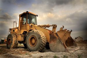 Construction equipment with curved glass