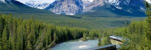 train in canadian rockies with curved glass